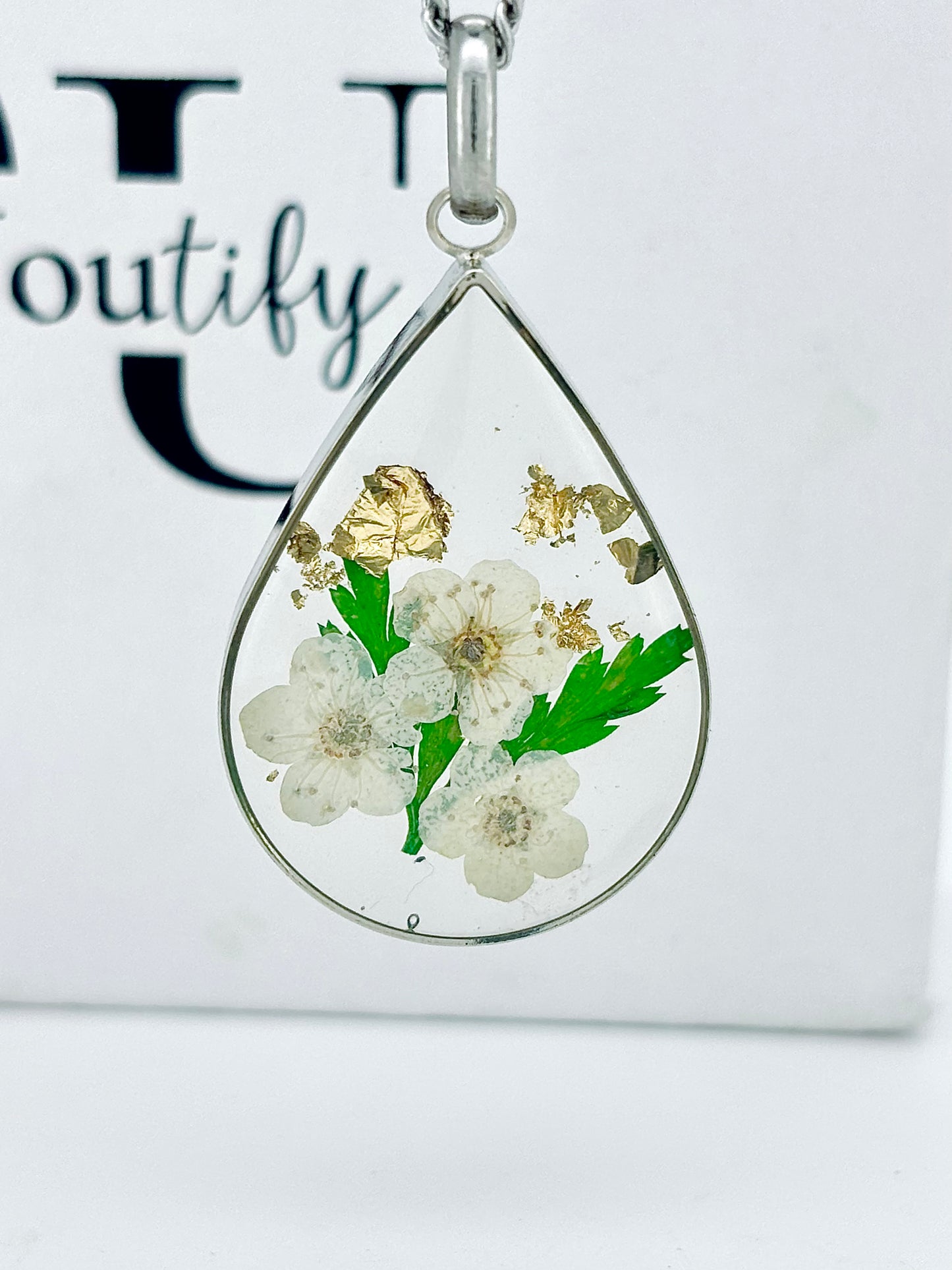 Real daisy flower necklace with gold leaf detail on a Silver chain 3cm tear drop resin pendant