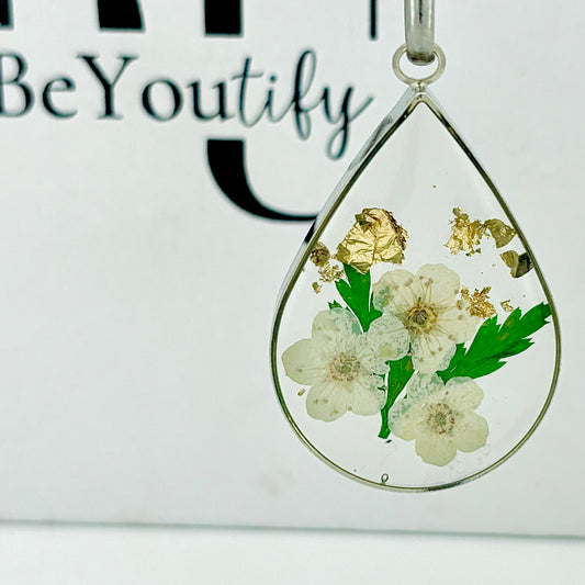 Real daisy flower necklace with gold leaf detail on a Silver chain 3cm tear drop resin pendant